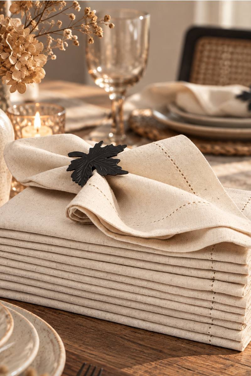 Flax linen napkins folded on a set autumn dinner table
